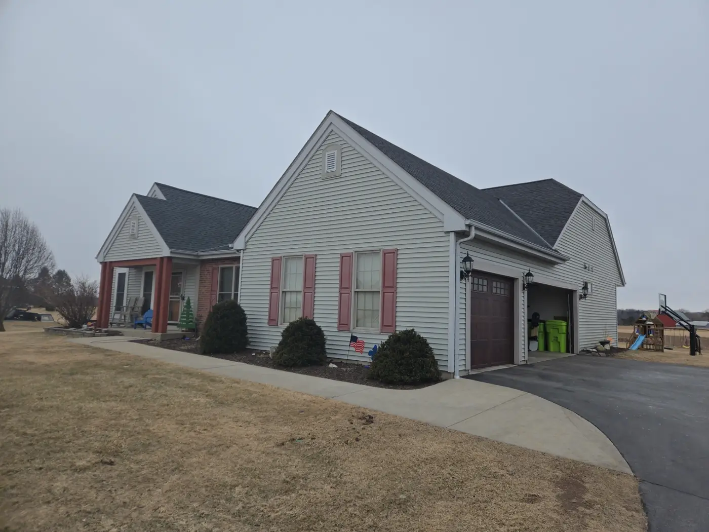Before front angle of a Richfield Wisconsin home before LP SmartSide siding replacement