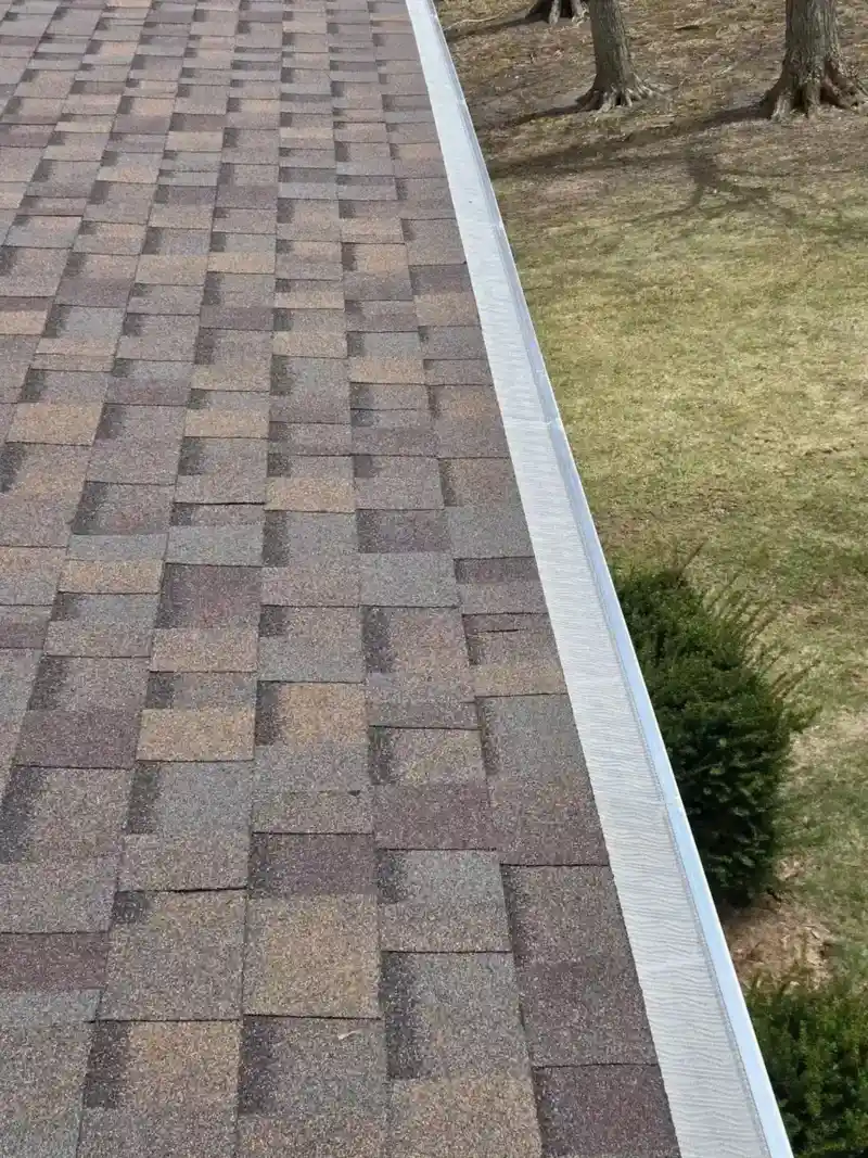 Multi-tone architectural shingles with new gutter guards
