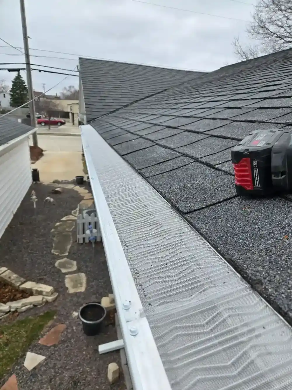 Newly installed gutter guards on a residential roof