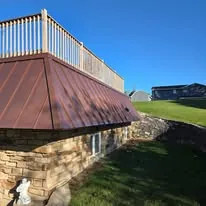 Copper standing-seam metal roof on a Wisconsin walkout with rooftop deck