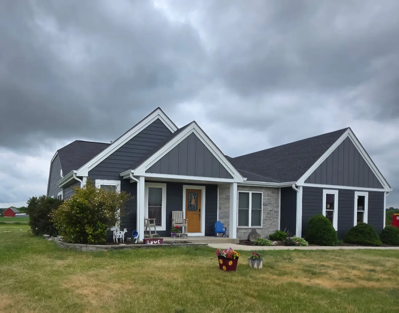 After front angle of a Richfield Wisconsin home with new LP SmartSide and bright white trim