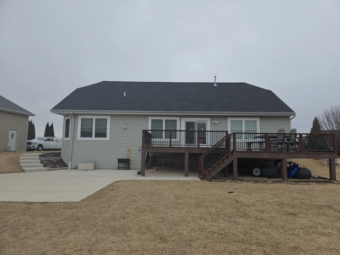 Before rear elevation of a Richfield Wisconsin home before new LP SmartSide siding and exterior trim