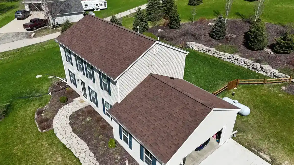 Aerial view of a Wisconsin two-story home with newly installed brown architectural shingle roof