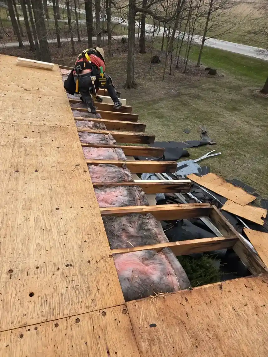 Worn shingle roof with damaged drip edge ready for tear-off