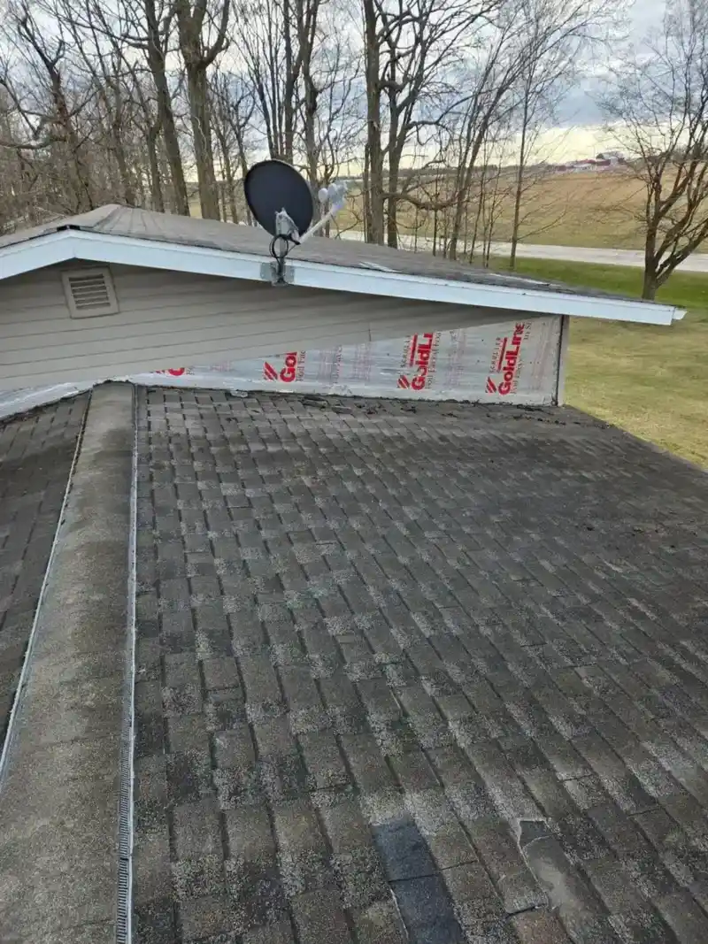 Aged asphalt shingle roof prior to replacement