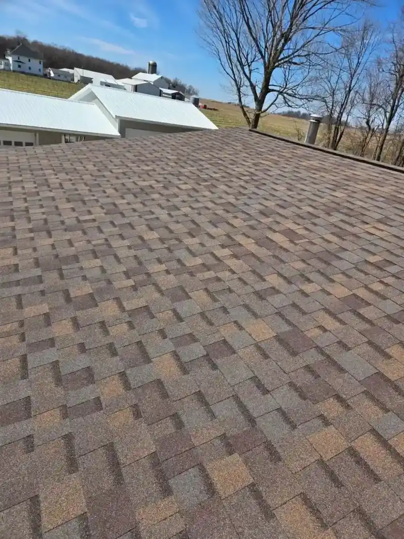 Designer architectural shingles installed on a Wisconsin farmhouse