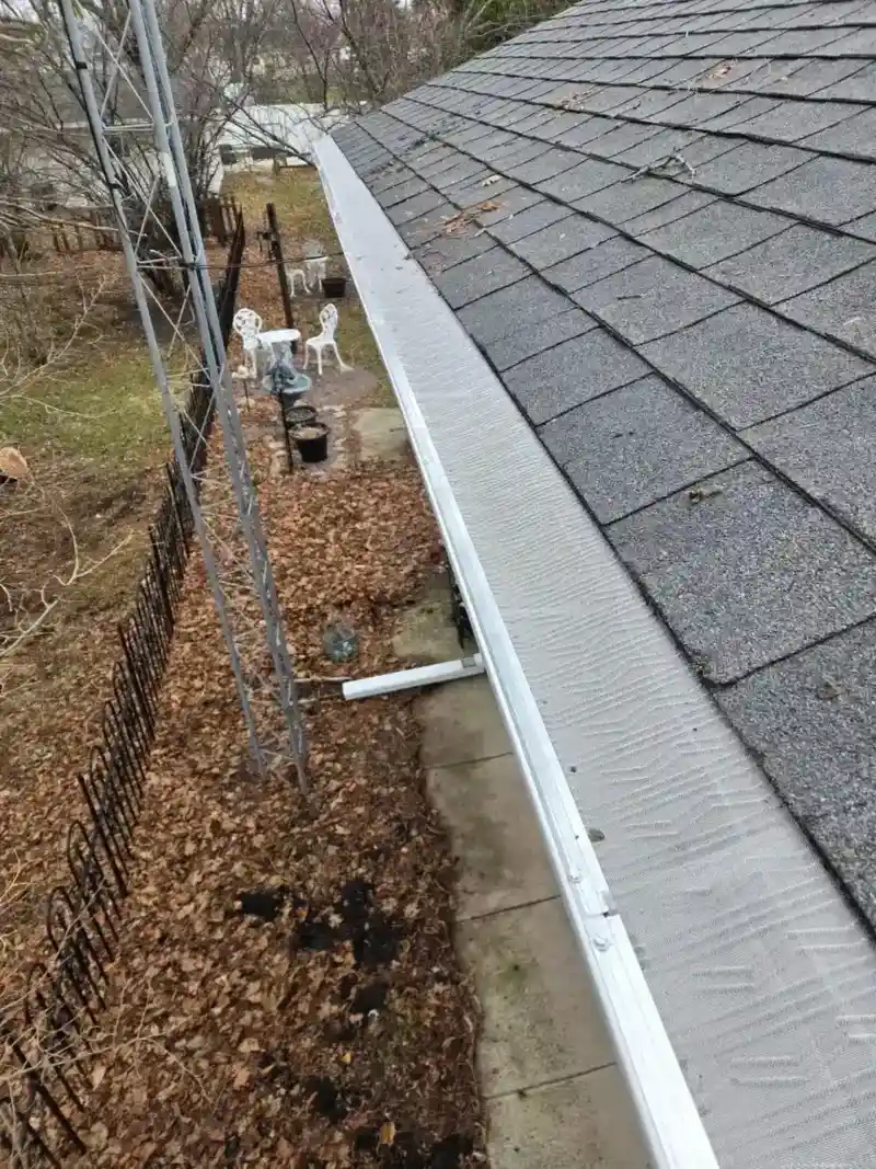 Aluminum gutter with mesh guard on a Wisconsin home