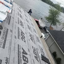 Low-slope roof underlayment installed before final roofing material on a lakefront home